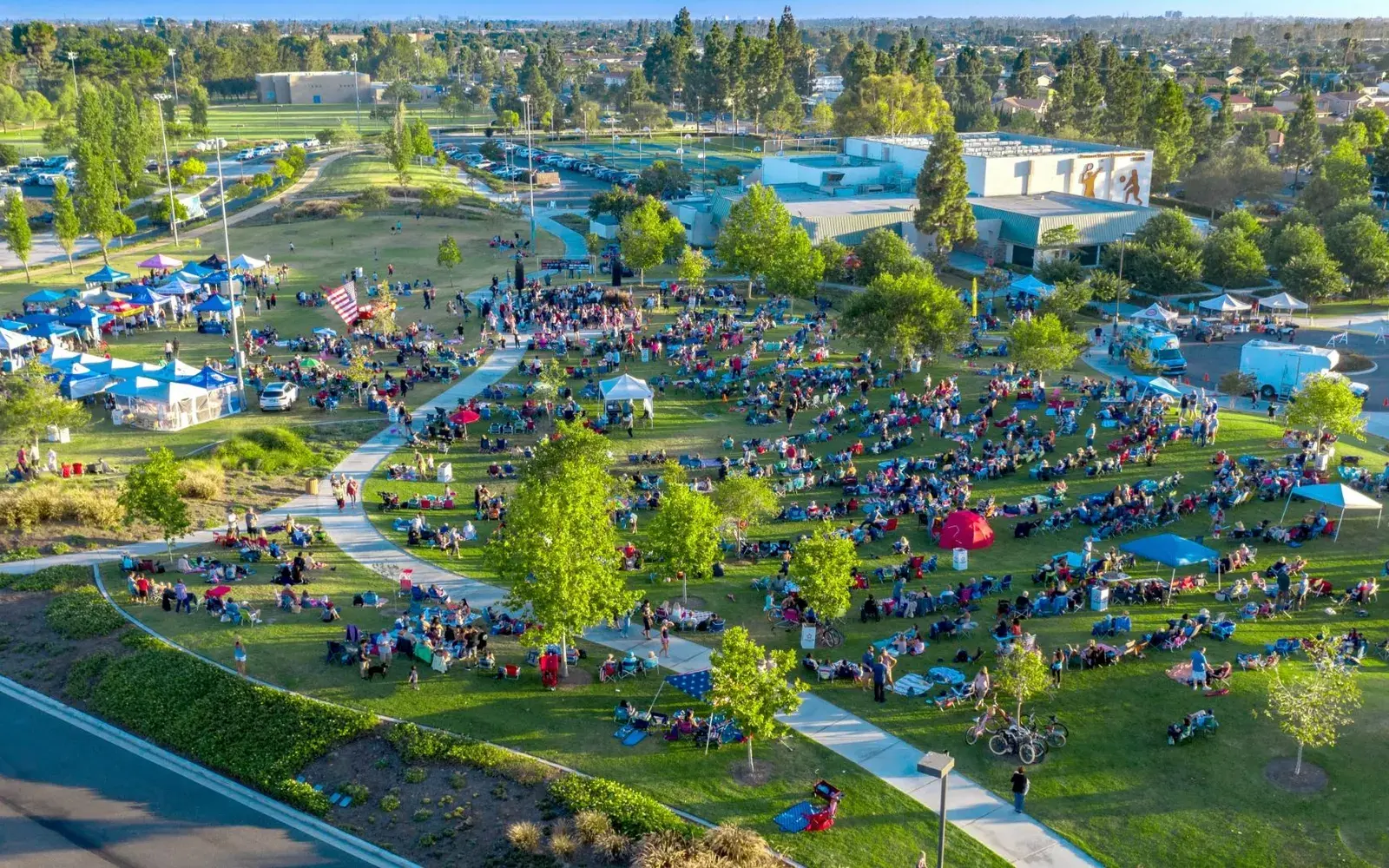 Aerial view of a large park filled with a community event in Fountain Valley, CA