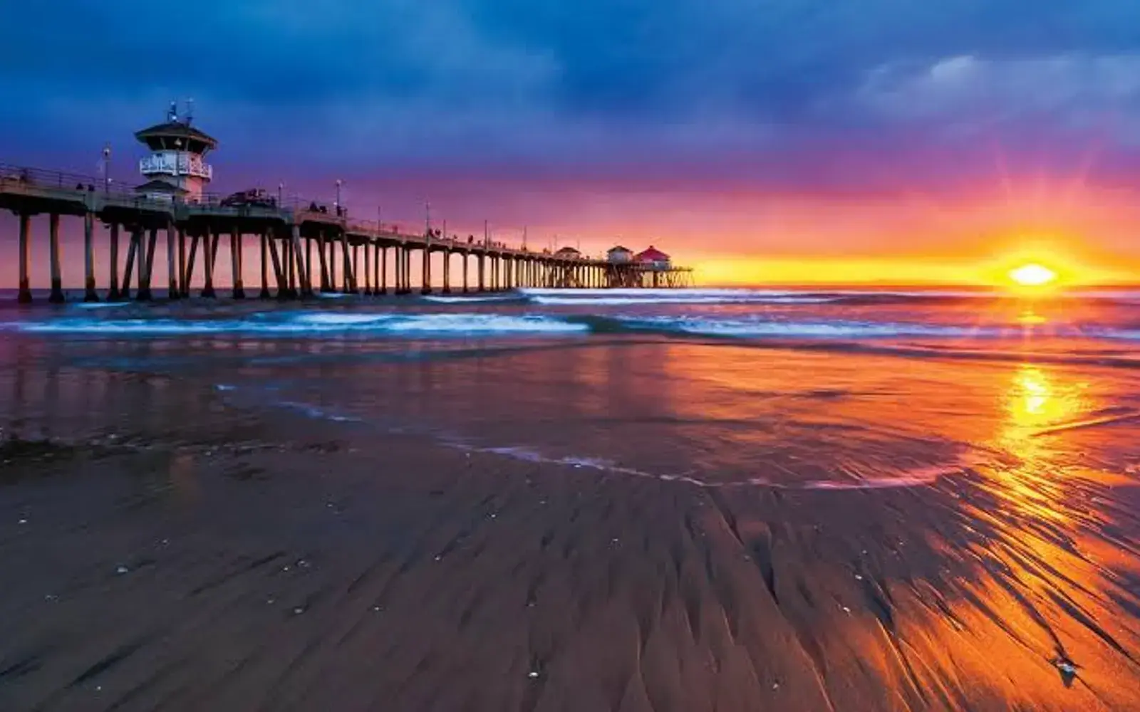Huntington Beach Pier at sunset, the landmark at the center of Huntington Beach, CA