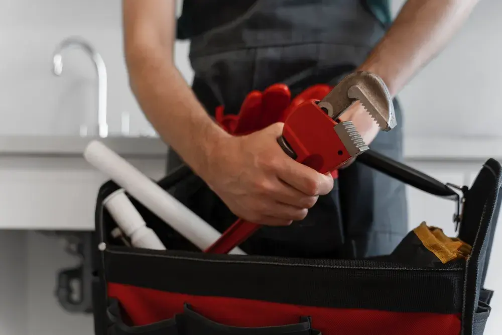 VeriTech plumber with tools ready for a scheduled service call