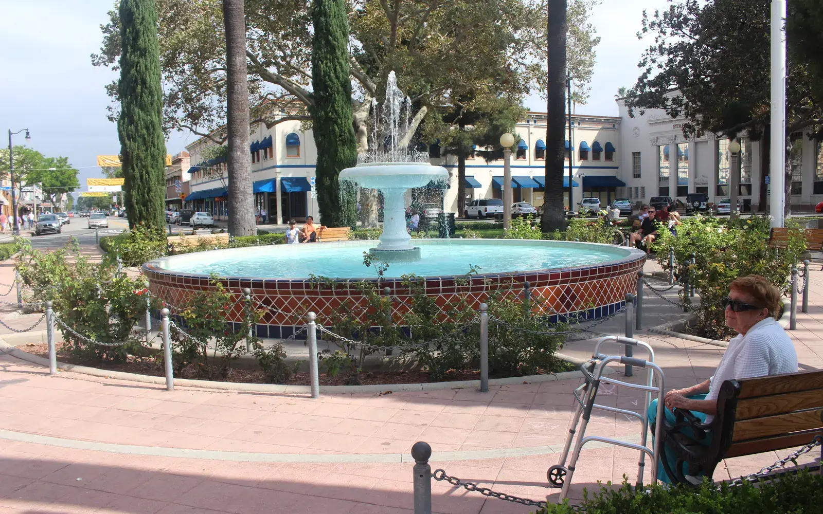 The Plaza fountain surrounded by palms and storefronts in Old Towne Orange, CA The Plaza fountain surrounded by palms and storefronts in Old Towne Orange, CA